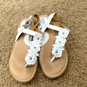 White sandals with floral detail